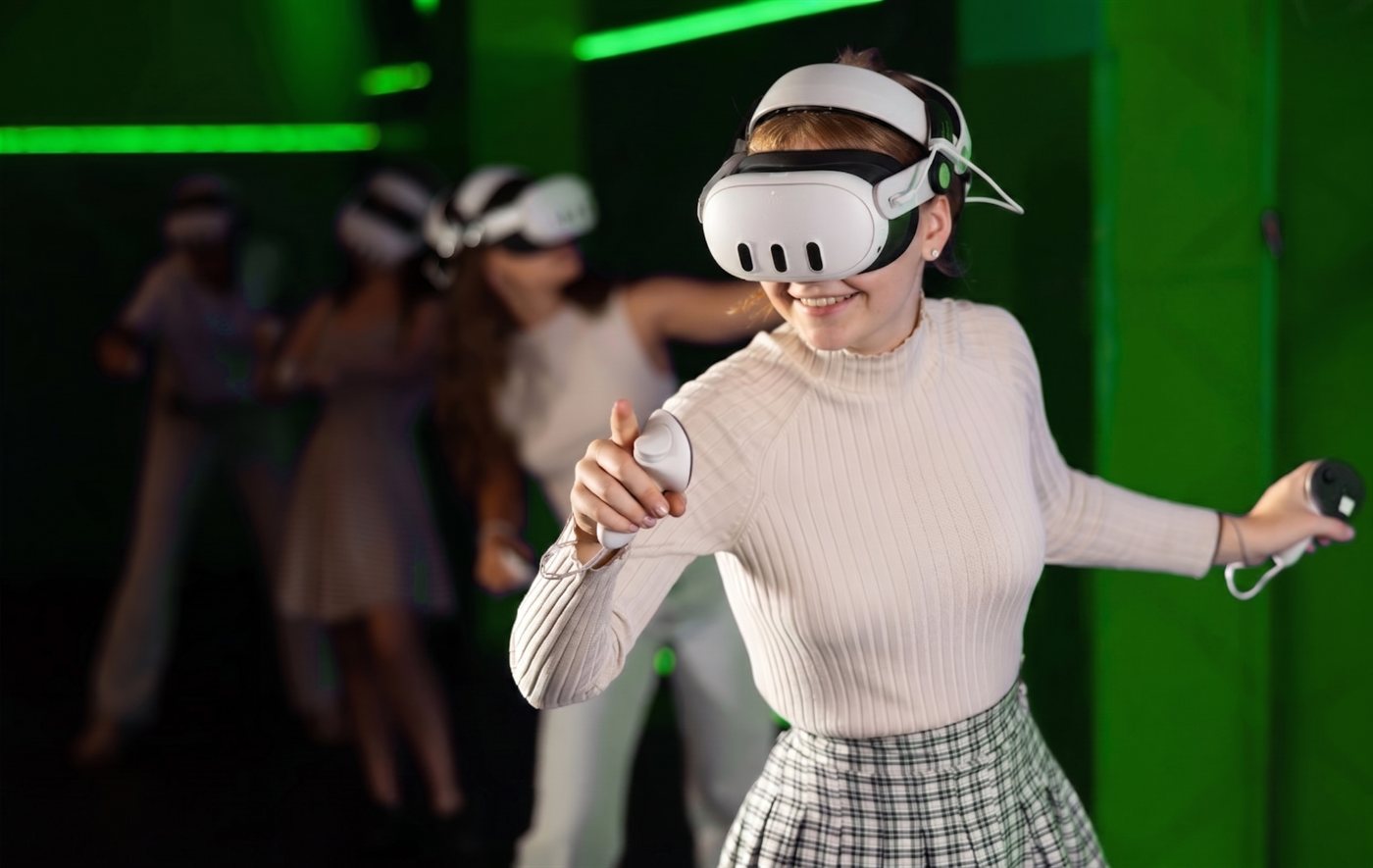 A guest putting on a Meta Quest 3 headset and starting to play with the host's help